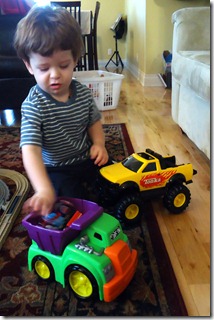 saylor playing with plastic dump truck
