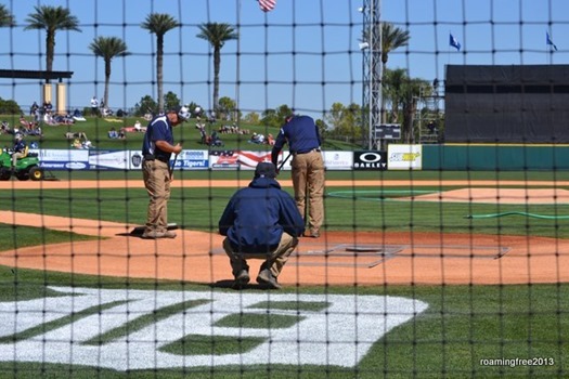 Groundskeepers get the field ready