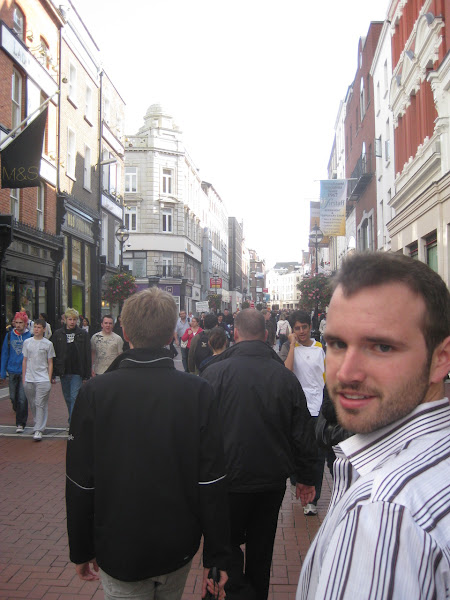 Walking down a busy pedestrian street in Dublin toward St. Stephen’s Green.