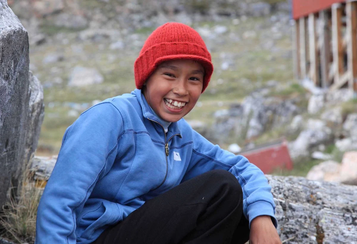 Greenland-Disko-Bay-local-boy - Travel with Hurtigruten to Disko Bay, Greenland, and meet the friendly, welcoming locals of the region.