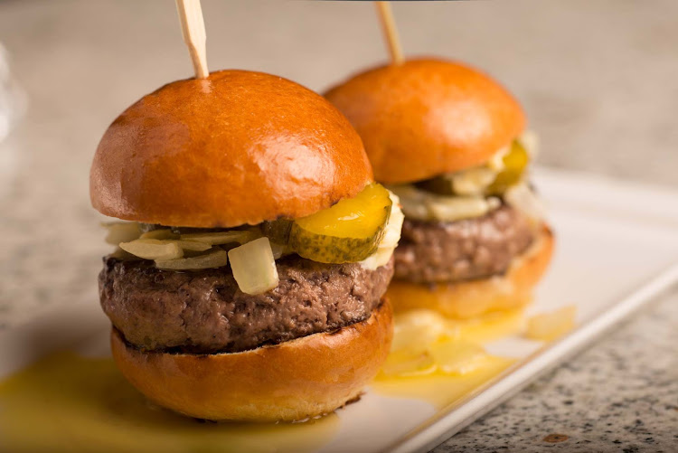 Famished? Find mouth-watering burgers at Tastes Bar & Restaurant on Crystal Serenity.