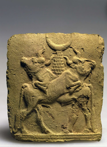Plaque depicting a pair of bulls, with a crescent symbolizing the moon god Sin atop a mountain-like pedestal on their backs