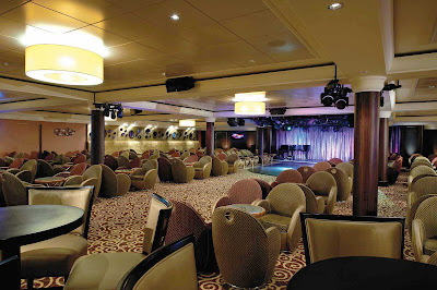 Dance the night away at the Spinnaker Lounge, one of the cozy yet festive spots aboard  Norwegian Dawn.