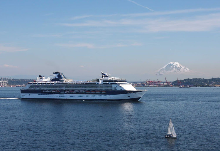 Celebrity Infinity sails out of Seattle Harbor with Mt. Rainier in the background.