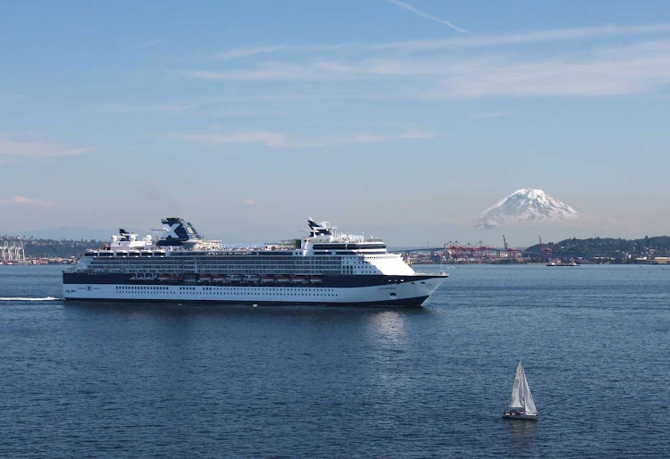 Celebrity Infinity sails out of Seattle Harbor with Mt. Rainier in the background.