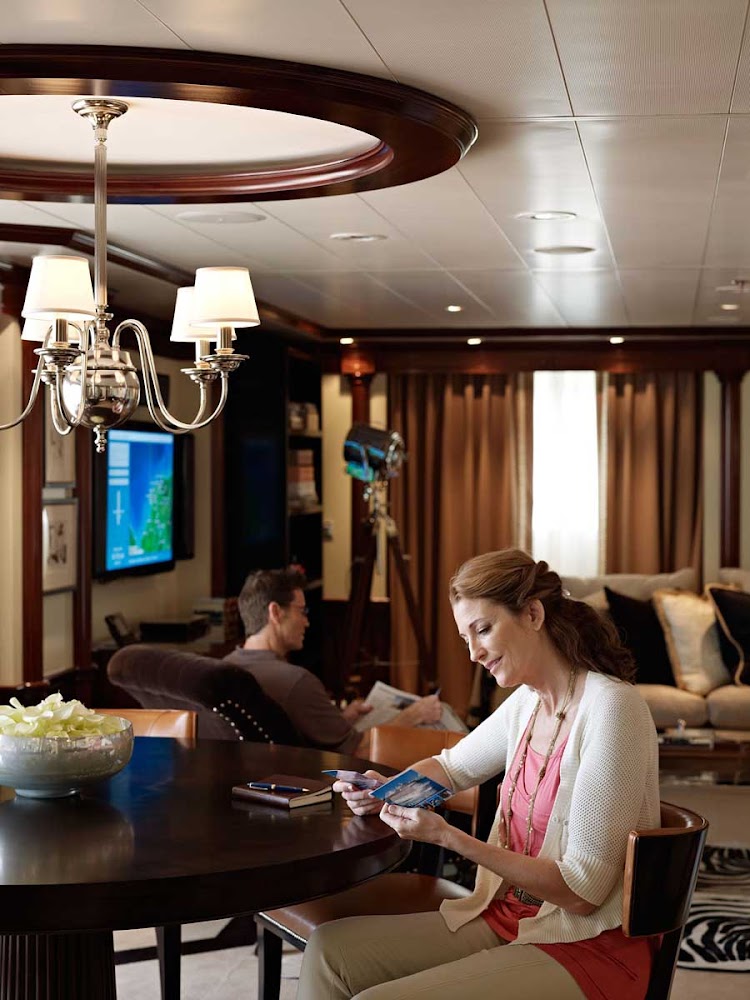 The living room in the Oceania Suite aboard Oceania Riviera is designed with comfort and quietude in mind.