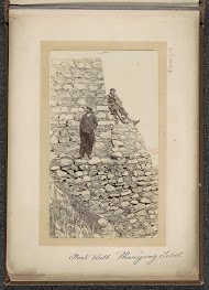 Two men on a wall of the Phari fort, Tibet