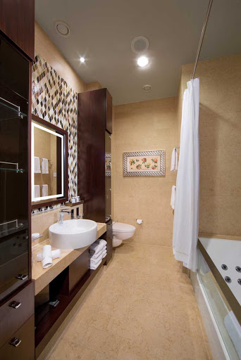 Celebrity_Reflection_Signature_Suite_bath-1 - You will love Celebrity Reflections' marble clad Signature Suite bathroom with it's own jet powered bath and plenty of storage.