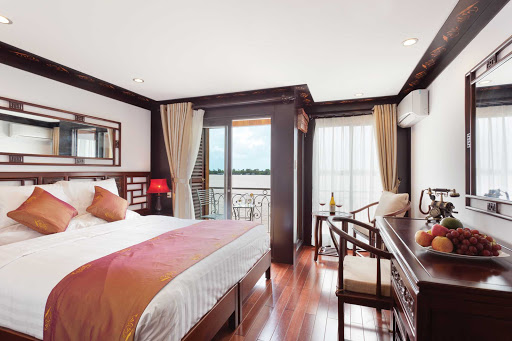 A twin balcony stateroom aboard AmaLotus. Staterooms include comfortable sitting areas, individually controlled air-conditioning, a mini-bar, safety deposit box, robes and slippers, and a luxurious bathtub.
