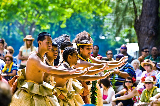 Hinaleimoana Wong Kalu, a native Hawaiian mahu, and her group perform in traditional Hawaiian garb at a May day event.