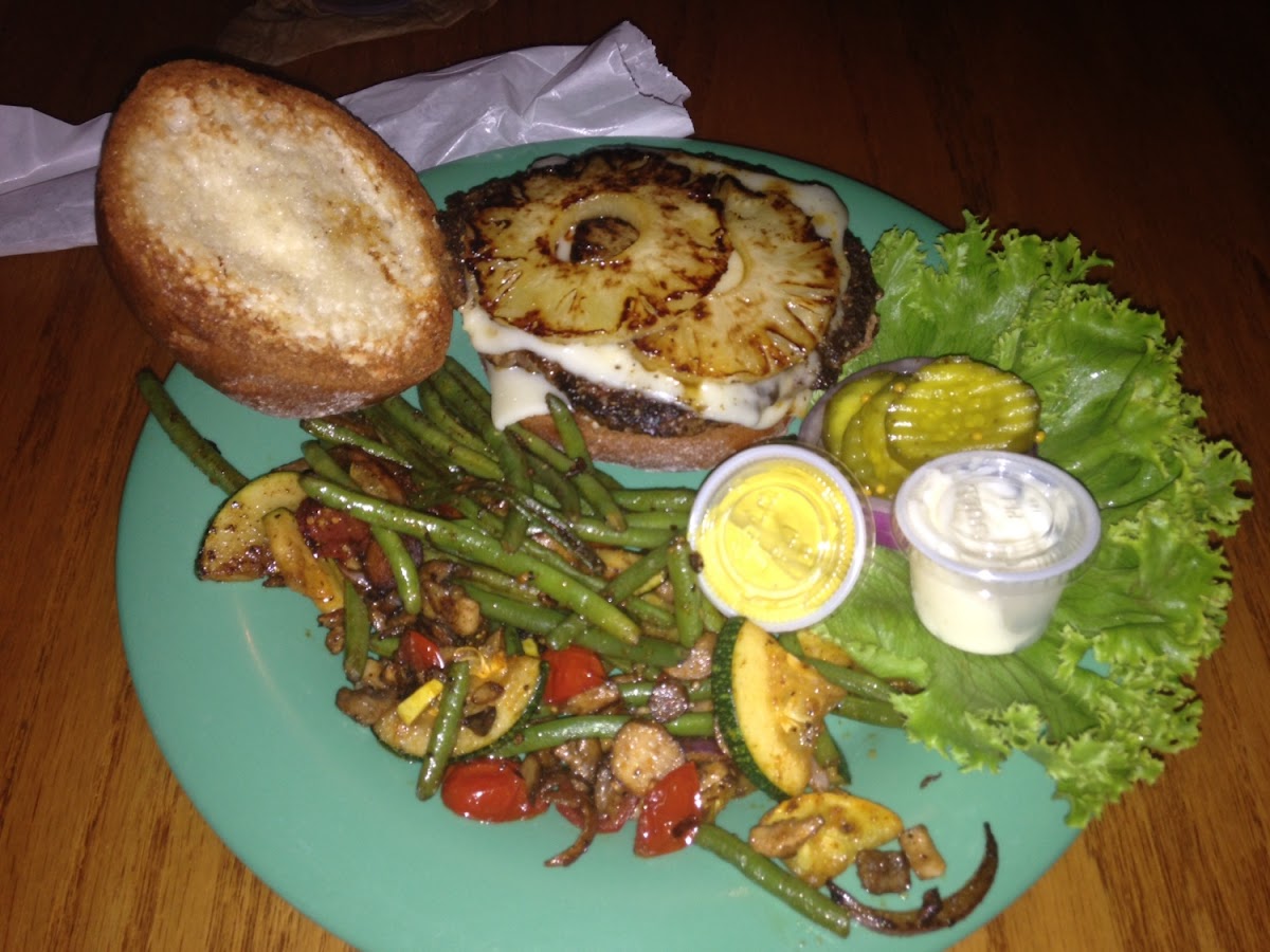 Gluten free burger with Swiss cheese and grilled pineapple.