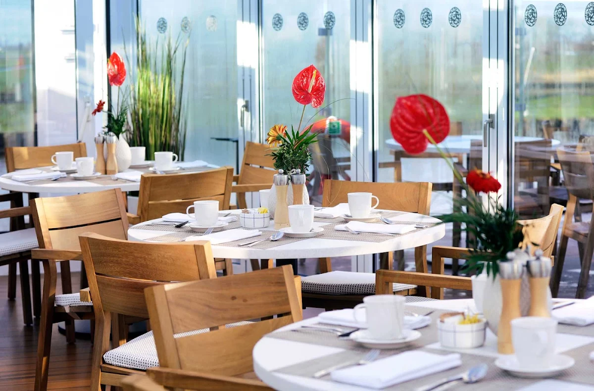 Viking-River-Cruises-Longships-Aquavit-Terrace-setting - Dine inside or on deck in the tastefully appointed Aquavit Terrace while taking in passing landscapes during your cruise of Europe's waterways aboard your Viking Longship. 