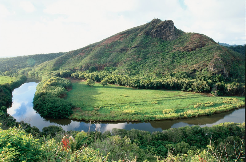 The Wailua River forms a blue ribbon around Wailua, Kauai.