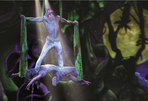 Watch a jungle-inspired aerial performance during Norwegian Epic's Cirque Dreams and Dinner Show.