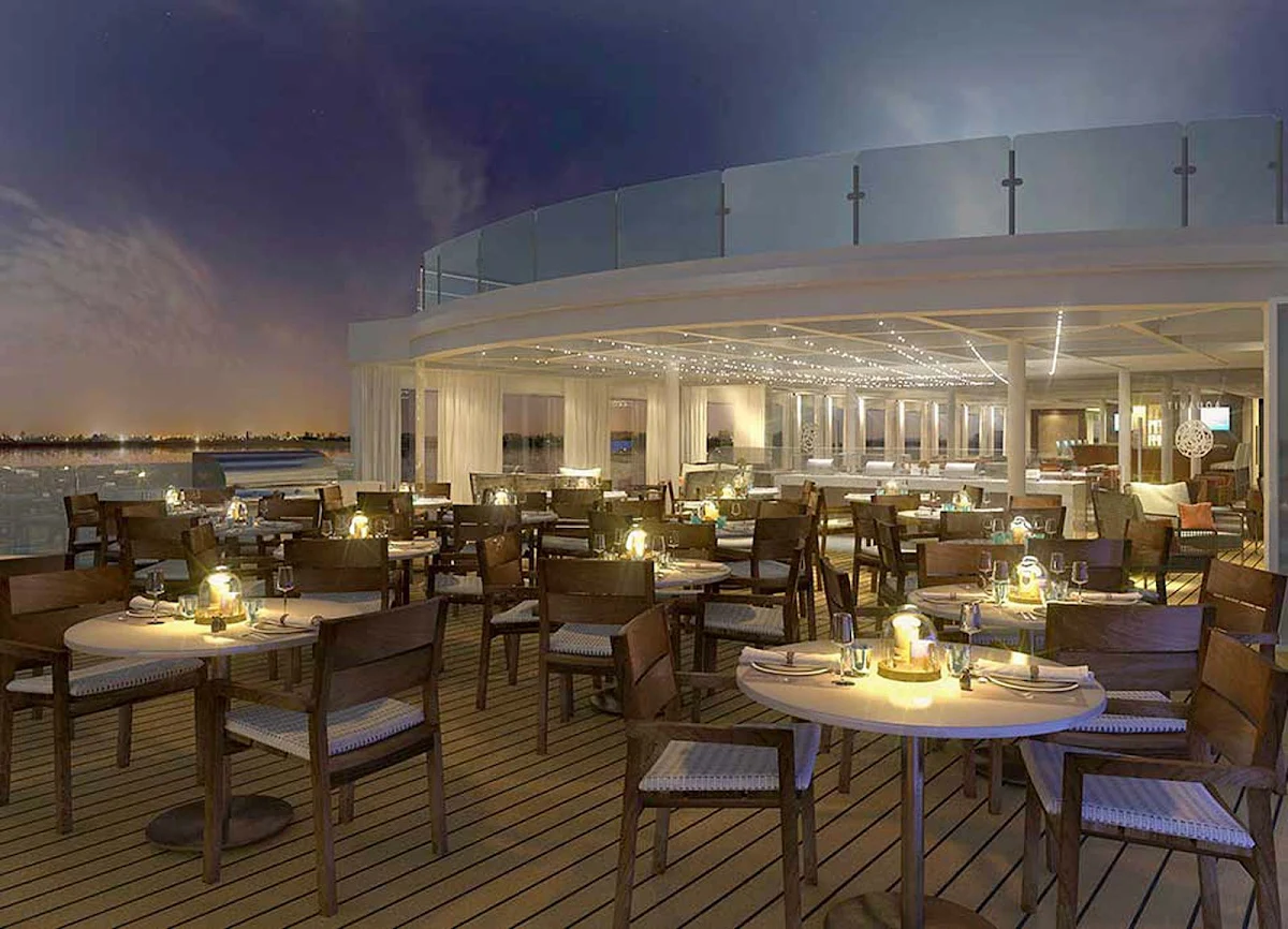 Viking-Longship-Aquavit-Terrace-at-dusk - At night the Aquavit Terrace aboard your Viking Longship transforms into a festive atmosphere perfect to enjoy a summer evening floating on Europe's waterways.
