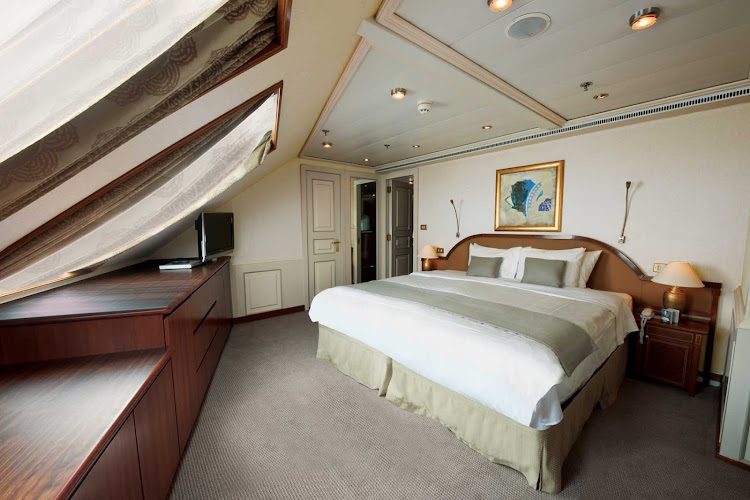 The Grand Suite aboard Silver Whisper has a spacious bedroom that features a queen size bed (or twin beds), sitting area and vanity table with hair dryer.