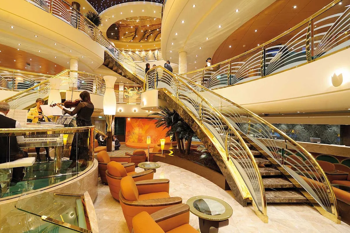 MSC-Poesia-Reception - MSC's signature piano adds a note of classic elegance to Poesia's  glamour-infused reception area.