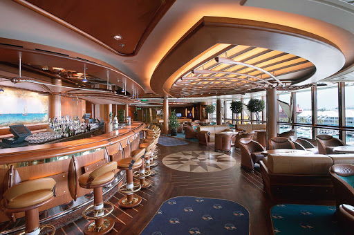 Grab a drink and take in the views at the nautical-themed Schooner Bar aboard Jewel of the Seas.
