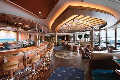 Grab a drink and take in the views at the nautical-themed Schooner Bar aboard Jewel of the Seas.