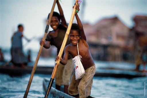 Silversea-Silver-Discoverer-Papua-New-Guinea-kids - Two boys on the Sepik River in Madang, Papua New Guinea. Take part in local traditions when you sail the South Seas with Silver Discoverer.