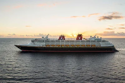 Disney Magic sails in tranquil seas at sunset to its next port of call. Itineraries include the Western Caribbean, Southern Caribbean, Bahamas, Northern Europe, Norwegian fjords, Iceland, Barcelona and elsewhere. 