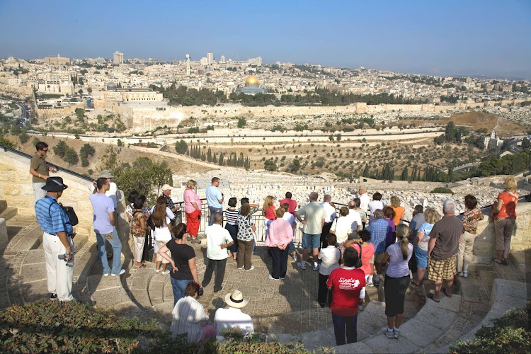 Visitors take in the sweeping view from Mount Zion, Israel. 