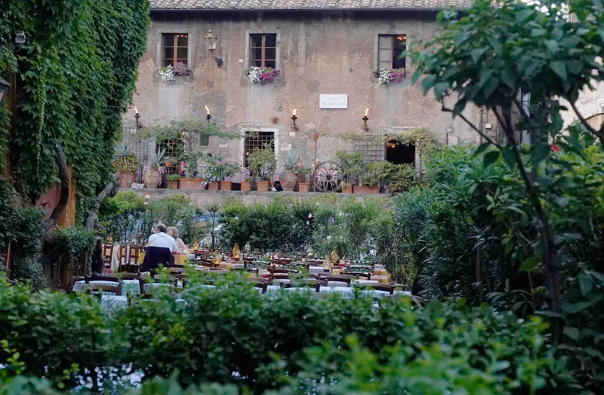 Piazza-dei-MercantiIn-Transtever-Rome - Dusk approaches at La Taverna dei Mercanti restaurant in the Trastevere district of Rome.  
