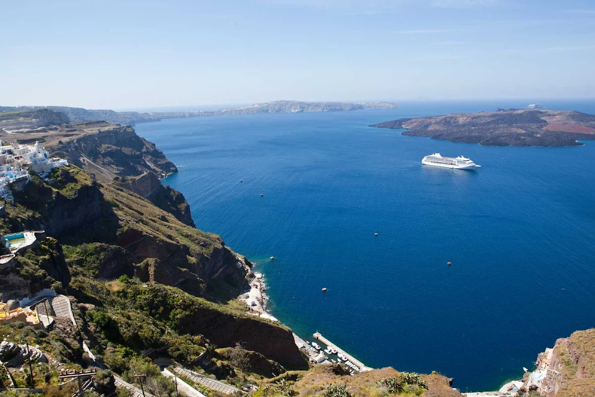 Regent-Seven-Seas-Mariner-Fira-Santorini-2 - Behold dramatic cliffs and the glimmering Aegean Sea from the hilltop capital of Fira during a cruise to Santorini and other Greek islands aboard Seven Seas Mariner.