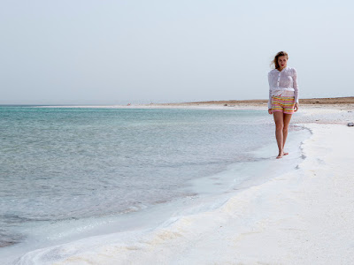 Walking along the shore of the Dead Sea.