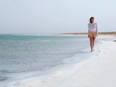 Walking along the shore of the Dead Sea.