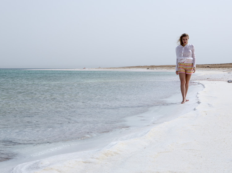 Walking along the shore of the Dead Sea.