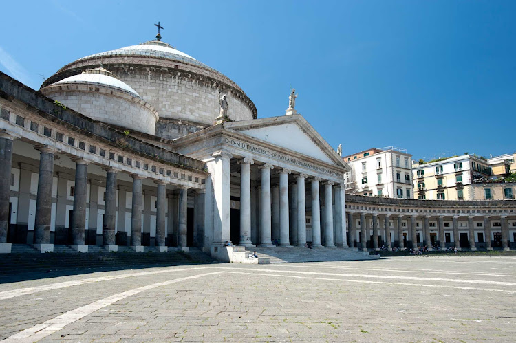 When you're exploring Naples, Italy, stop to admire the curved façade of the San Francesco di Paola church, located in the city's grand public square, Piazza del Plebiscito.