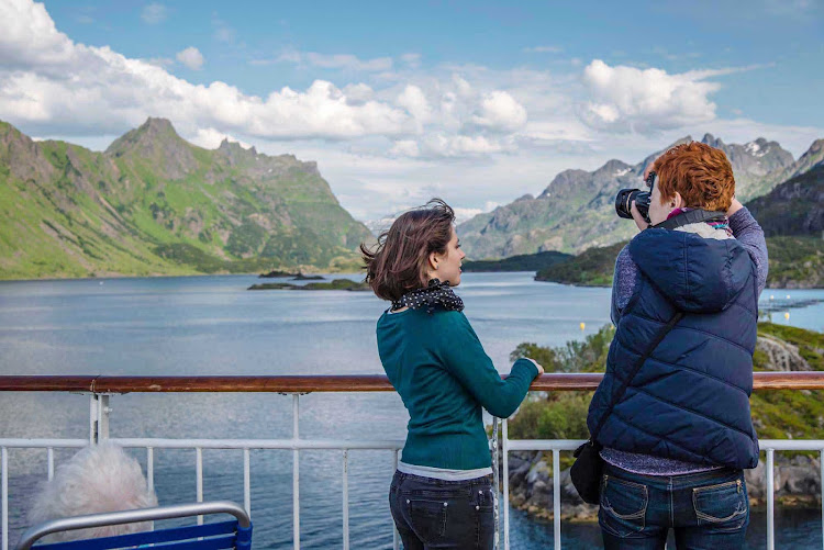 Capture the dramatic scenery of Nordland from the deck of Hurtigruten's Midnatsol during your summer journey along  Norway's scenic coastline. 