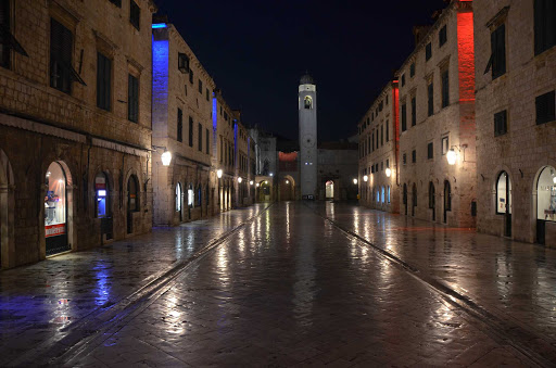 A Dubrovnik street scene on a rainy evening.