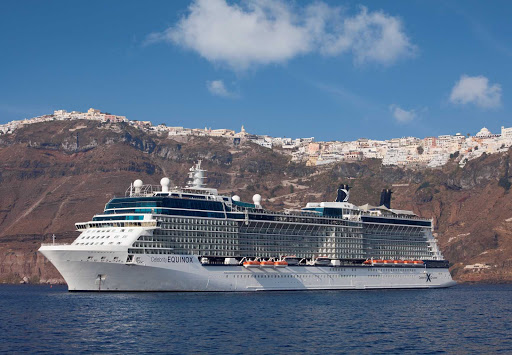 Celebrity_Equinox_Santorini - Celebrity Equinox moors beneath the majestic cliffs of Santorini, Greece.