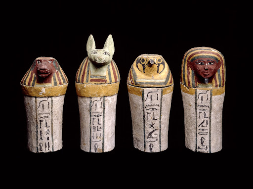 Painted wooden canopic jars