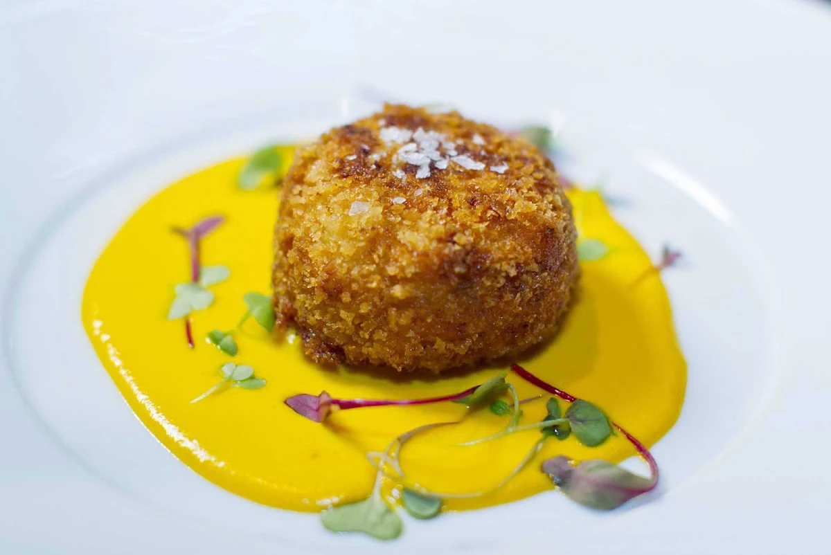 150-Central-Park-Royal-Caribbean-appetizer-3-1 - An appetizer with a rich, zesty sauce served at 150 Central Park aboard Allure of the Seas, under the direction of James Beard Award-winning chef and Miami restaurateur Michael Schwartz.