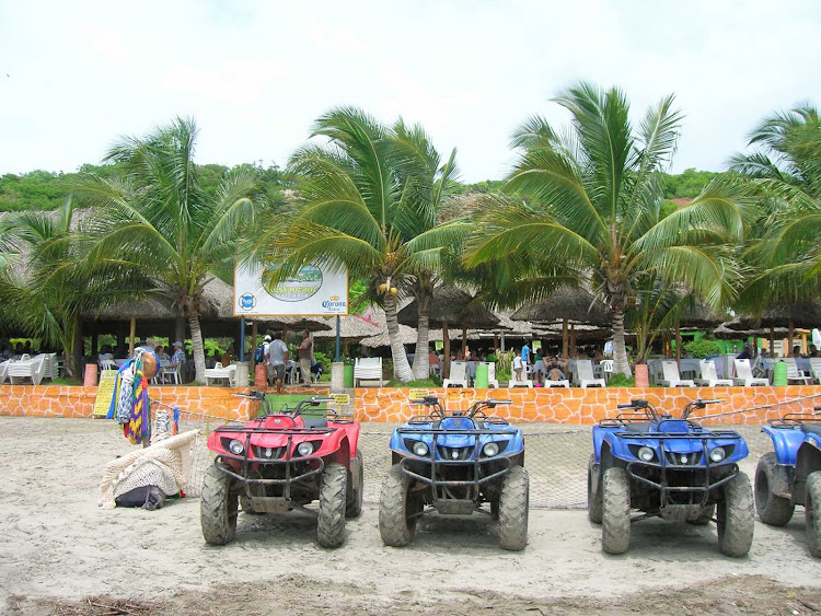 All-terrain vehicles ready to roll on the beach at Mazatlan, Mexico.