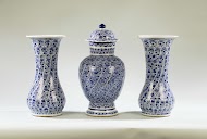 Ovoid jar and domed cover with spiralling bands of flower sprays