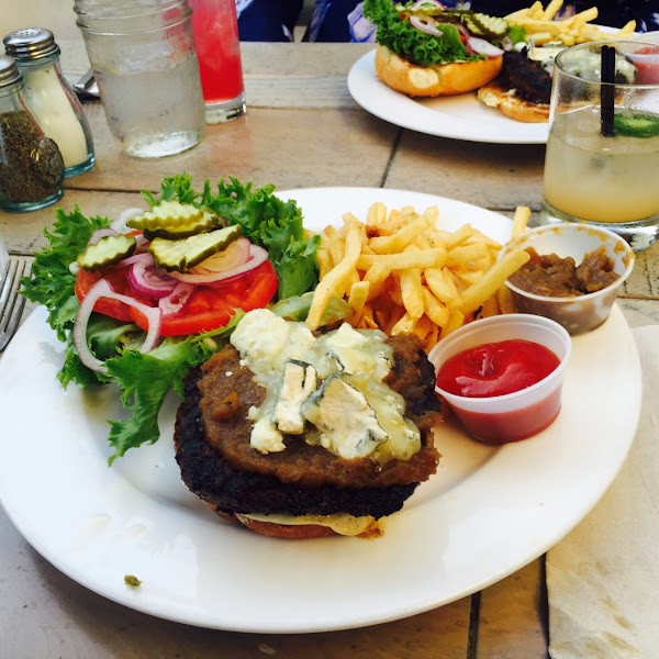 Hamburger with gluten-free bun. Substitute fruit or salad for the fries, since the fries are not cer