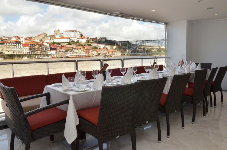 Enjoy al fresco dining on the deck of AmaVida as you take in scenic villages along the Douro River in Portugal. 
