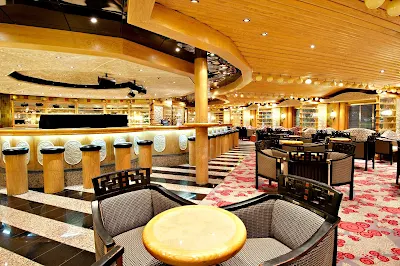 Sing along to your favorite tunes at the Ivory Piano Bar, on Carnival Pride's deck 3.