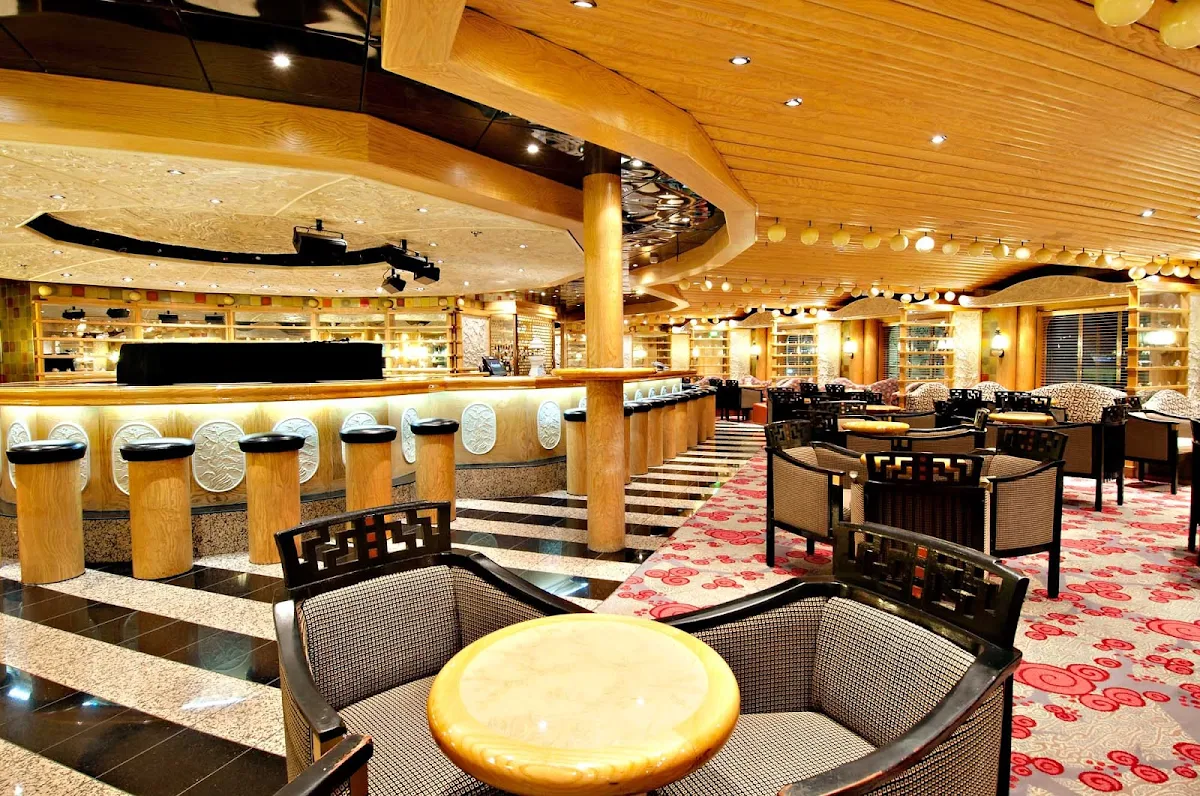 Carnival-Pride-Ivory-Piano-Bar - Sing along to your favorite tunes at the Ivory Piano Bar, on Carnival Pride's deck 3.
