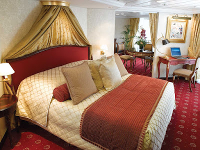 Spanning nearly 1,000 square feet, the Owner's Suite aboard Oceania Insignia includes a queen bed with 1,000-thread-count linens, private teak veranda for watching the passing landscapes, a second bathroom, two flat-screen TVs, laptop, iPad, 24-hour butler service, complimetary in-suite bar setup, priority embarkation and more. 