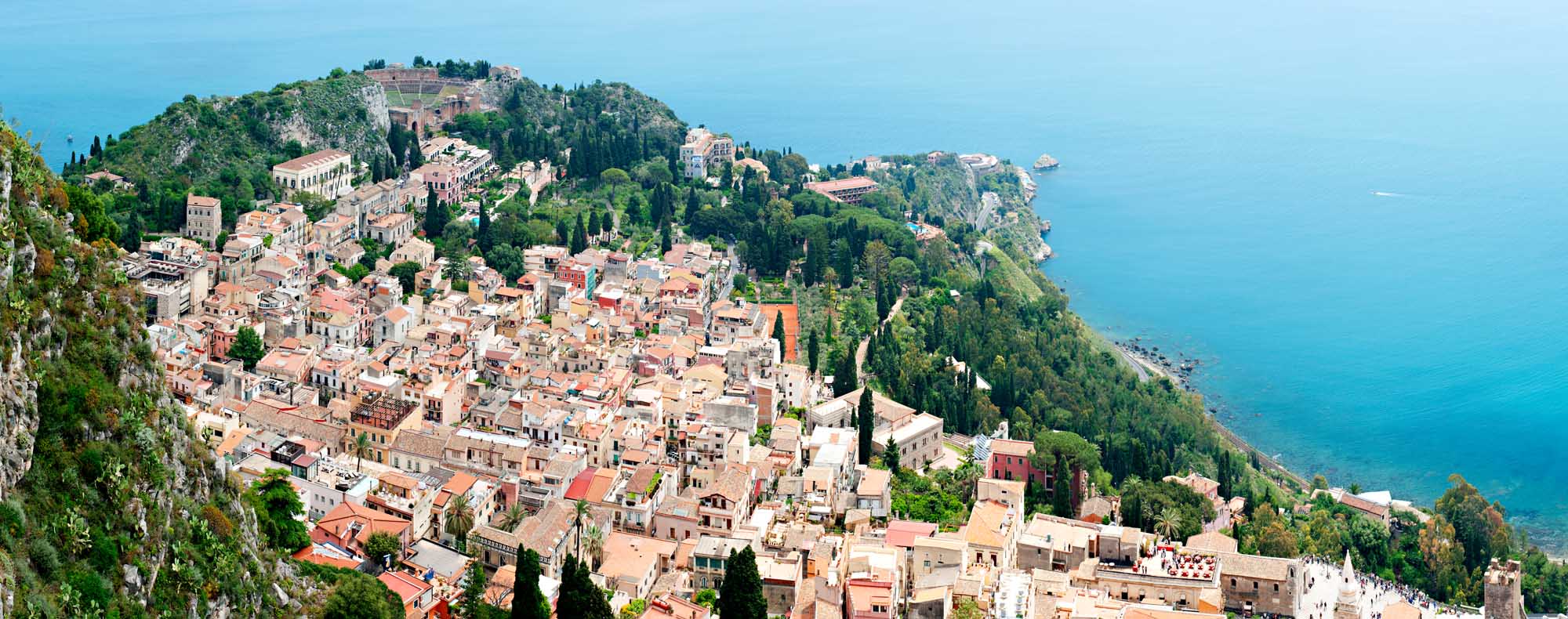 Taormina, on the east coast of the island of Sicily, Italy, has been a popular tourist destination for 200 years.