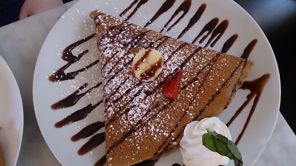 gluten free crepe with nutella, fresh strawberries and bananas.