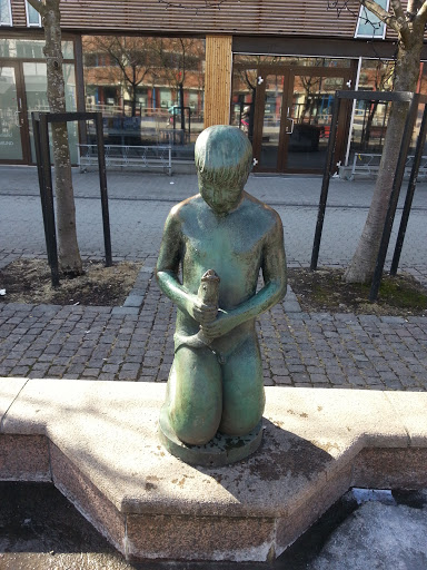Boy with Fish Statue