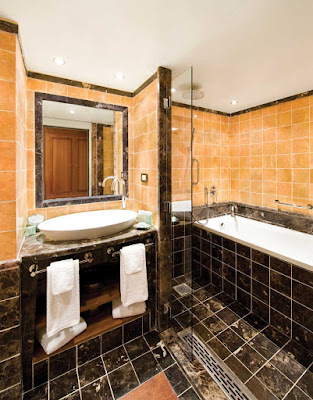 The Silver Suite bathroom aboard Silver Wind is tastefully decorated with marble tiling and a full bath. Marble bathrooms are the standard aboard all Silversea ships.