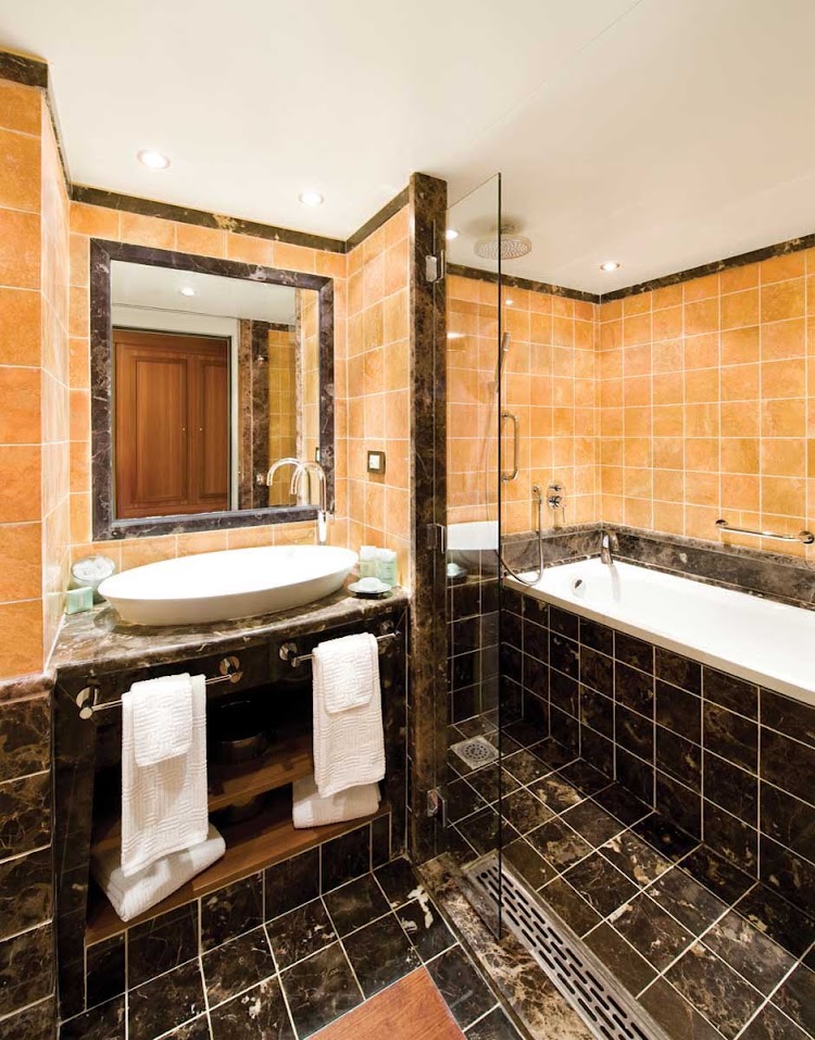 The Silver Suite bathroom aboard Silver Wind is tastefully decorated with marble tiling and a full bath. Marble bathrooms are the standard aboard all Silversea ships.