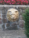 Lion Head on Stone Wall